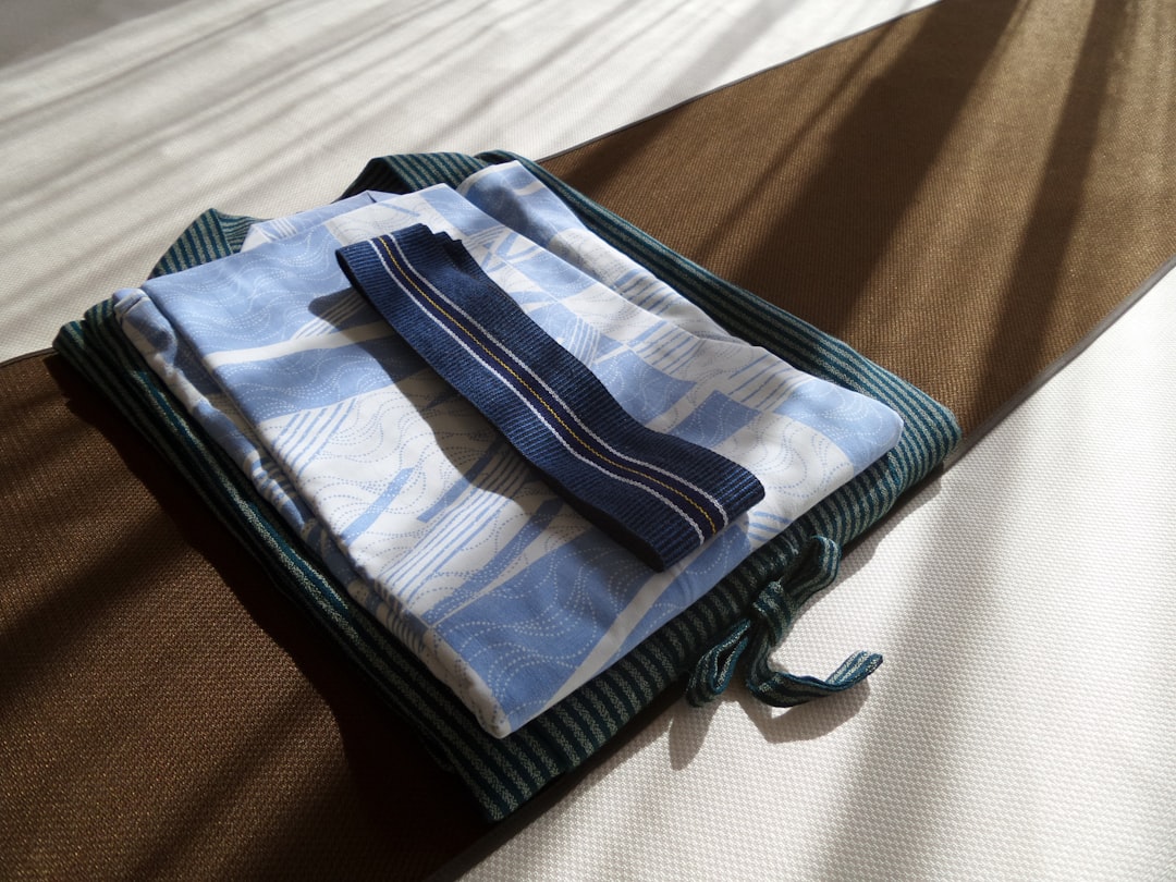 capsule wardrobe for travel packed in a clean suitcase with coordinated layers and accessories